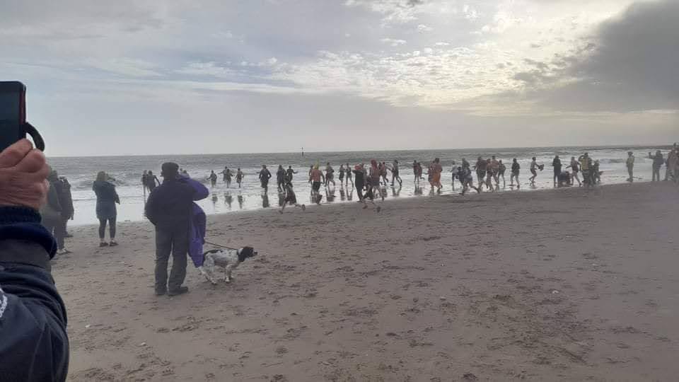 Swimmers entering the sea