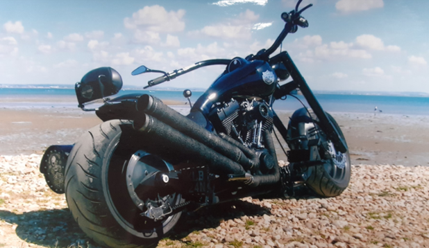 Harley Motorbike sat on Sandown Beach