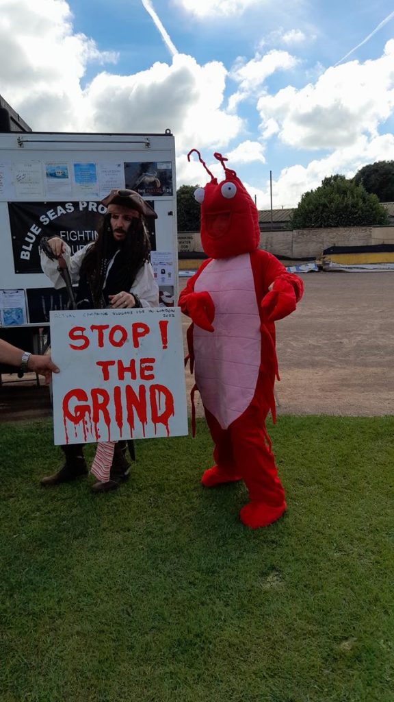 Sharklab roadshow trailer with Lobby lobster and pirate characters with 'stop the grind' sign